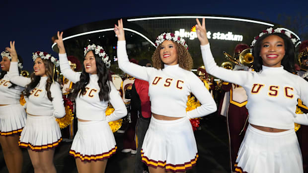 Southern California Trojans song girls cheerleaders perform at a tailgate pep rally during the Las Vegas Bowl