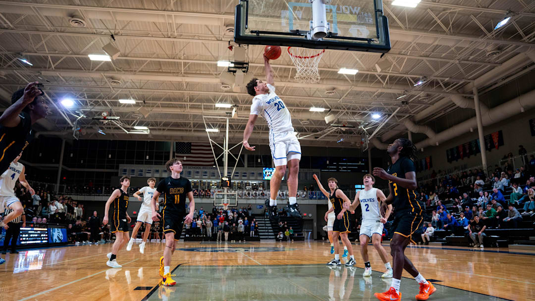 Northwest’s Isaiah Oliver (20) dunks the ball late in the game against Southeast Polk on Dec. 19, 2025, at Waukee Northwest.