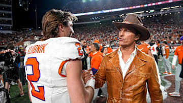 Dec 21, 2024; Austin, Texas, USA; Movie actor Matthew McConaughey (right) meets Clemson Tigers quarterback Cade Klubnik (2) after a victory by the Texas Longhorns in the first round of the College Football Playoffs at Darrell K Royal-Texas Memorial Stadium. Mandatory Credit: Aaron E. Martinez/USA Today Network via Imagn Images
