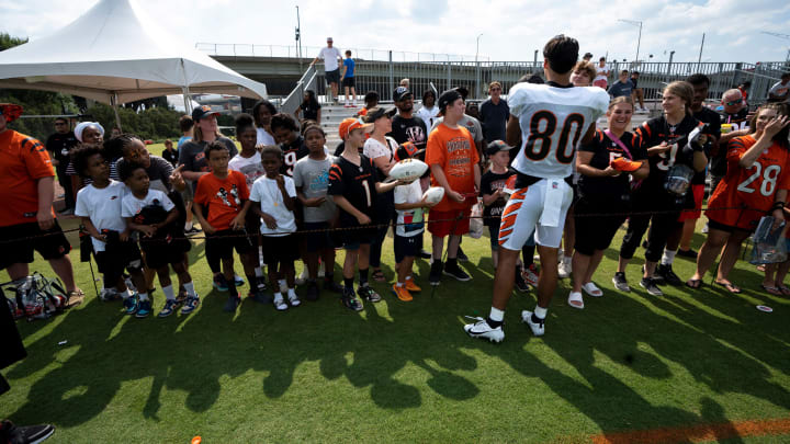 Cincinnati Bengals wide receiver Andrei Iosivas (80) signs autographs at the Cincinnati Bengals NFL training camp practice in Cincinnati on Thursday, Aug. 3, 2023.