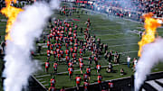 Cincinnati Bearcats run onto the field before the NCAA football game between the Cincinnati Bearcats and UCF Knights at Nippert Stadium in Cincinnati on Oct. 11, 2025.