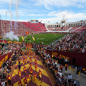 Nov 30, 2024; Los Angeles, California, USA; A general overall view as Southern California Trojans players enter the field before the game against the Notre Dame Fighting Irish at United Airlines Field at Los Angeles Memorial Coliseum. Mandatory Credit: Kirby Lee-Imagn Images