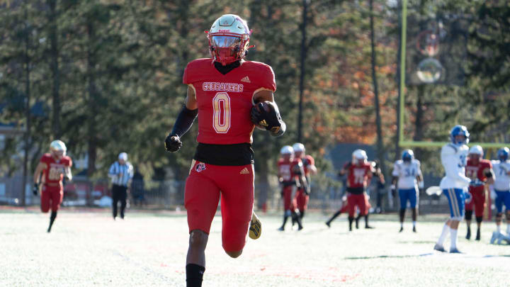 Nov 18, 2023; Oradell, NJ, USA; Donovan Catholic football at Bergen Catholic in a State, Non-Public A, semifinal game. BC #0 Quincy Porter runs for a touchdown after making a catch in the third quarter.