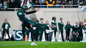 Oct 25, 2025; East Lansing, Michigan, USA; Michigan State Spartans punter Ryan Eckley (96) punts the ball against the Michigan Wolverines during the first half at Spartan Stadium. Mandatory Credit: Brendan Mullin-Imagn Images
