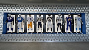 The uniforms and helmets of players at the Los Angeles Chargers headquarters and practice facility at The Bolt. 
