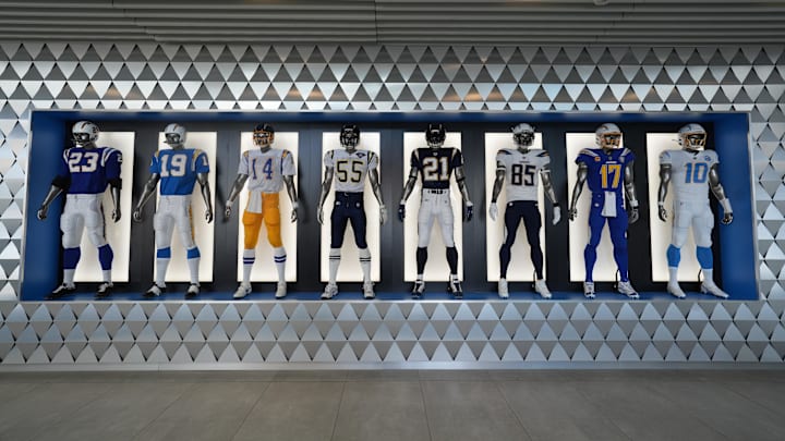 The uniforms and helmets of players at the Los Angeles Chargers headquarters and practice facility at The Bolt. 
