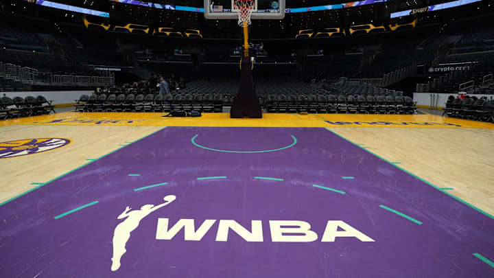 The WNBA logo on the court at Crypto.com Arena.