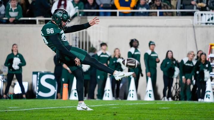 Oct 25, 2025; East Lansing, Michigan, USA; Michigan State Spartans punter Ryan Eckley (96) punts the ball against the Michigan Wolverines during the first half at Spartan Stadium. Mandatory Credit: Brendan Mullin-Imagn Images