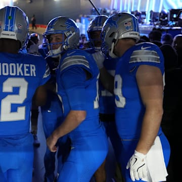 Detroit Lions quarterback Jared Goff (16) huddles with teammates in the tunnel before the NFC divisional round between the Detroit Lions and the Washington Commanders at Ford Field in Detroit on Saturday, Jan. 18, 2025.
