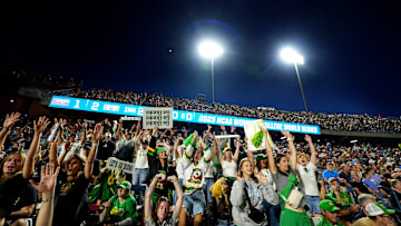 Oregon fans cheer during following Women's College World Series softball game between the Oregon Ducks and the Ole Miss Rebels at Devon Park in Oklahoma City, Friday, May, 30, 2025.
