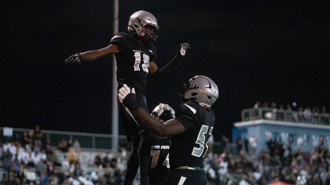 St. Peter Prep's Amari Jones (10) celebrates with his teammate Olubobola Oluwasemilore (52) during a high school football game between St. Peter’s Prep and Paramus Catholic in Jersey City on Friday, Aug. 29, 2025.
