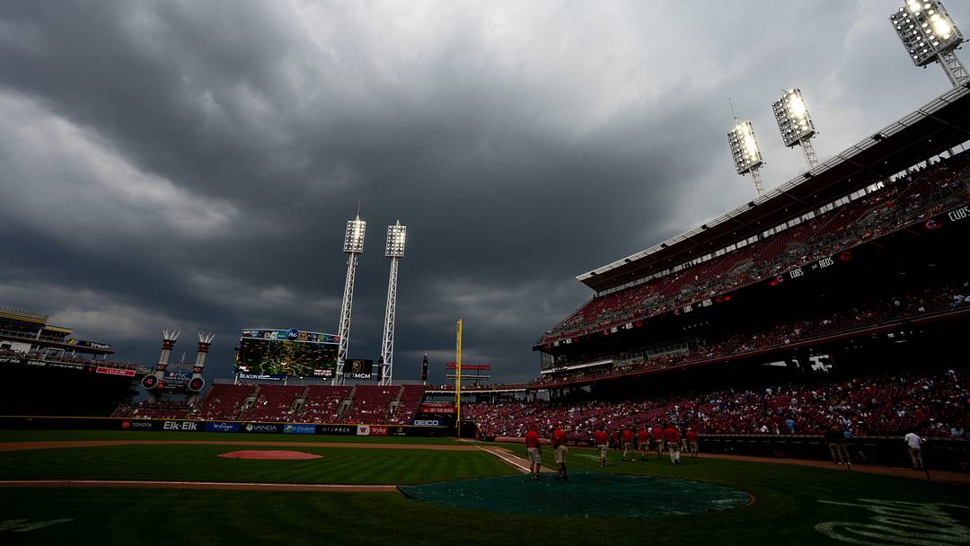 Grounds crew puts a tarp on home plate as the game between Cincinnati Reds and Chicago Cubs is delayed by rain at Great American Ball Park in Cincinnati on Sept. 21, 2025. Grounds crew puts a tarp on home plate as the game between Cincinnati Reds and Chicago Cubs is delayed by rain at Great American Ball Park in Cincinnati on Sept. 21, 2025.