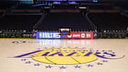 Jan 23, 2025; Los Angeles, California, USA; The Los Angeles Lakers logo at midcourt at the Crypto.com Arena. Mandatory Credit: Kirby Lee-Imagn Images