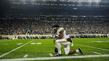 Michigan running back Justice Haynes prays before kickoff against Michigan State at Spartan Stadium in East Lansing on Saturday, October 25, 2025.