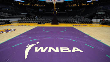  The WNBA logo on the court at Crypto.com Arena.