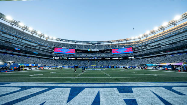 Players warm up before a Thursday Night Football game between the New York Giants and the Eagles at MetLife Stadium