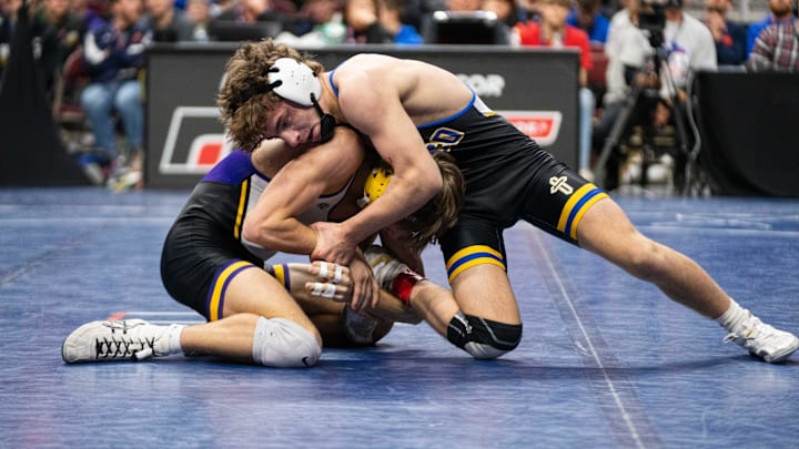 Don Bosco's Dawson Youngblut wrestles Alburnett's Preston Klostermann at 138 lbs during the Class 1A state wresting final on Saturday, Feb. 22, 2025, at Wells Fargo Arena in Des Moines.