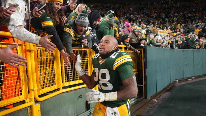 Green Bay Packers running back AJ Dillon (28) makes a victory lap after beating the Chiefs on Dec. 3.