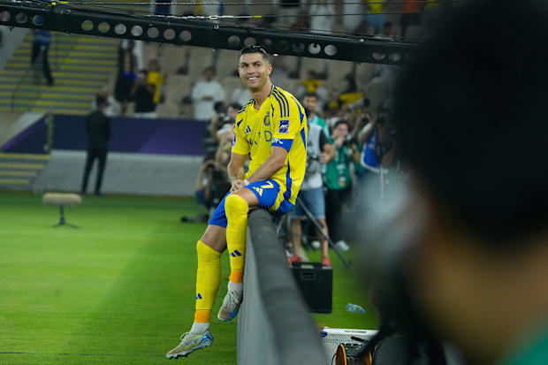Cristiano Ronaldo grinning for Al Nassr.