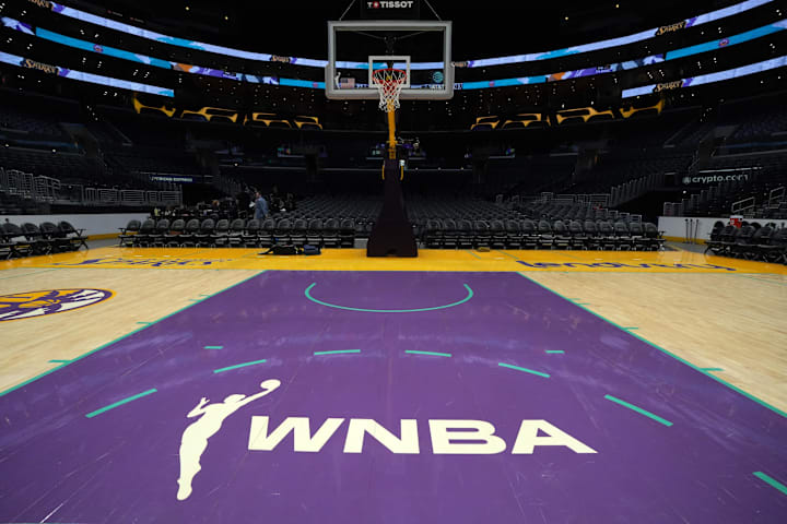The WNBA logo on the court at Crypto.com Arena. 