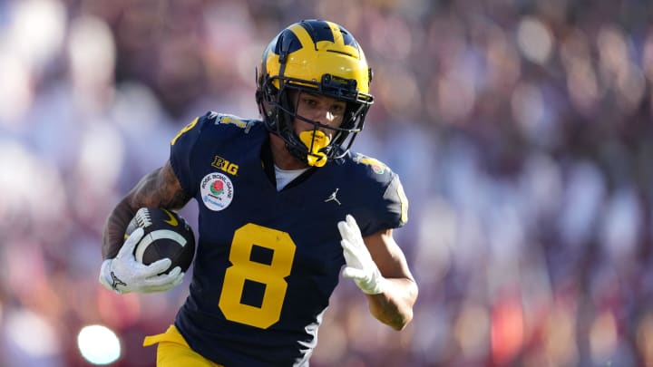 Jan 1, 2024; Pasadena, CA, USA; Michigan Wolverines wide receiver Tyler Morris (8) runs with the ball during the first half against the Alabama Crimson Tide in the 2024 Rose Bowl college football playoff semifinal game at Rose Bowl. Mandatory Credit: Kirby Lee-USA TODAY Sports