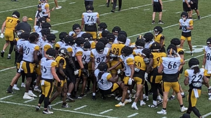 A scuffle breaks out after quarterback Justin Fields was hit to the ground at Pittsburgh Steelers training camp at Saint Vincent College in Latrobe, Pennsylvania on July 31, 2024. 