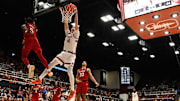 Feb 8, 2025; Stanford, California, USA; Stanford Cardinal forward Maxime Raynaud (42) dunks against NC State Wolfpack guard Trey Parker (5) in the second half at Maples Pavilion. Mandatory Credit: Eakin Howard-Imagn Images