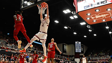 Feb 8, 2025; Stanford, California, USA; Stanford Cardinal forward Maxime Raynaud (42) dunks against NC State Wolfpack guard Trey Parker (5) in the second half at Maples Pavilion. Mandatory Credit: Eakin Howard-Imagn Images