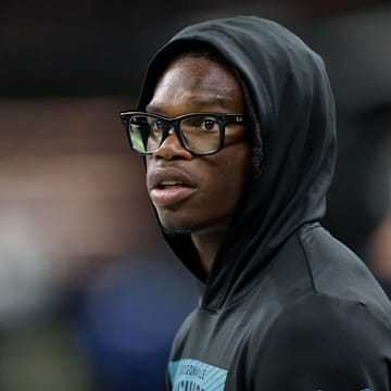 Aug 17, 2025; New Orleans, Louisiana, USA; Jacksonville Jaguars wide receiver Travis Hunter (12) watches from the sidelines during a game against the New Orleans Saints at Caesars Superdome. Mandatory Credit: Matthew Hinton-Imagn Images