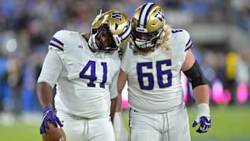 Nov 22, 2025; Pasadena, California, USA;  Washington Huskies defensive lineman Deshawn Lynch (41) is congratulated by offensive lineman Landen Hatchett (66) after a fumble recovery during the first half against the UCLA Bruins at the Rose Bowl. Mandatory Credit: Jayne Kamin-Oncea-Imagn Images