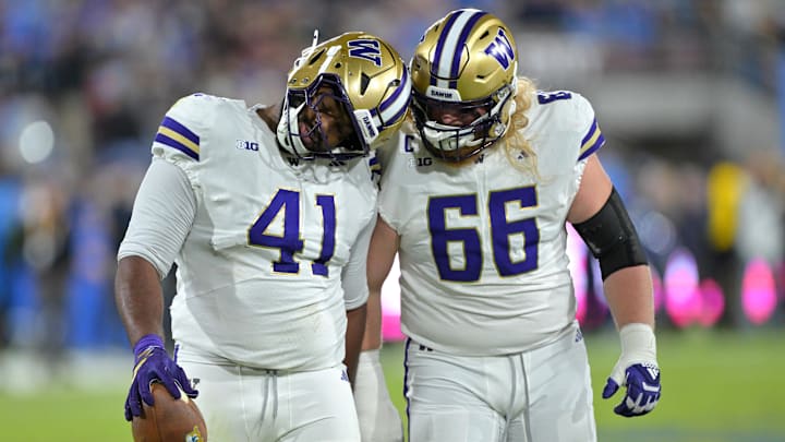 Nov 22, 2025; Pasadena, California, USA;  Washington Huskies defensive lineman Deshawn Lynch (41) is congratulated by offensive lineman Landen Hatchett (66) after a fumble recovery during the first half against the UCLA Bruins at the Rose Bowl. Mandatory Credit: Jayne Kamin-Oncea-Imagn Images