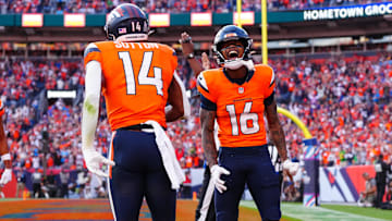 Oct 13, 2024; Denver, Colorado, USA; Denver Broncos wide receiver Troy Franklin (16) celebrates the touchdown by wide receiver Courtland Sutton (14) in the second half against the Los Angeles Chargers at Empower Field at Mile High. 