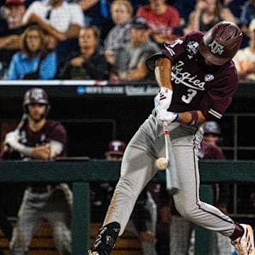 Jun 19, 2024; Omaha, NE, USA; Texas A&M Aggies second baseman Kaeden Kent (3) hits a RBI single against the Florida Gators during the ninth inning at Charles Schwab Field Omaha. Mandatory Credit: Dylan Widger-Imagn Images