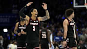 Mar 15, 2025; Charlotte, NC, USA; Louisville Cardinals guard Terrence Edwards Jr. (5) and guard J'Vonne Hadley (1) celebrate after a play in the first half of the 2025 ACC Conference Championship game against the Duke Blue Devils at Spectrum Center. Mandatory Credit: Bob Donnan-Imagn Images