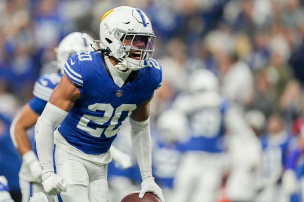 Indianapolis Colts safety Nick Cross reacts after a play in a blue jersey.