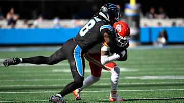 Nov 24, 2024; Charlotte, North Carolina, USA;  Kansas City Chiefs wide receiver Xavier Worthy (1) is tackled by Carolina Panthers cornerback Jaycee Horn (8) in the second quarter at Bank of America Stadium. Mandatory Credit: Bob Donnan-Imagn Images
