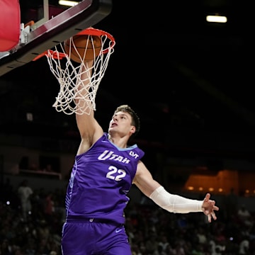 Jul 14, 2025; Las Vegas, NV, USA;  Utah Jazz forward Kyle Filipowski (22) dunks the ball against the San Antonio Spurs during the first half of a NBA basketball game at the Thomas & Mack Center. Mandatory Credit: Lucas Peltier-Imagn Images