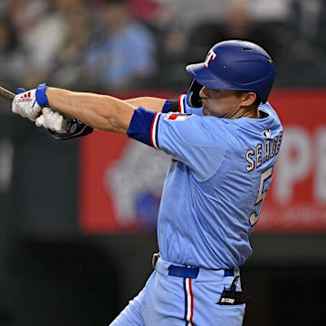Apr 20, 2025; Arlington, Texas, USA; Texas Rangers shortstop Corey Seager (5) bats during the game between the Texas Rangers and the Los Angeles Dodgers at Globe Life Field. 