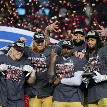 Jan 28, 2024; Santa Clara, California, USA; (Left to right) San Francisco 49ers running back Christian McCaffrey (23), tight end George Kittle (85), offensive tackle Trent Williams (71), wide receiver Deebo Samuel (19), and linebacker Fred Warner (54), and quarterback Brock Purdy (13) celebrate after winning the NFC Championship football game against the Detroit Lions at Levi's Stadium. Mandatory Credit: Kyle Terada-Imagn Images