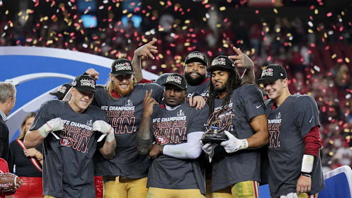 Jan 28, 2024; Santa Clara, California, USA; (Left to right) San Francisco 49ers running back Christian McCaffrey (23), tight end George Kittle (85), offensive tackle Trent Williams (71), wide receiver Deebo Samuel (19), and linebacker Fred Warner (54), and quarterback Brock Purdy (13) celebrate after winning the NFC Championship football game against the Detroit Lions at Levi's Stadium. Mandatory Credit: Kyle Terada-Imagn Images