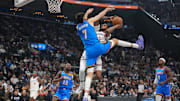Nov 4, 2025; Inglewood, California, USA; LA Clippers forward Derrick Jones Jr. (5) shoots the ball against Oklahoma City Thunder center Chet Holmgren (7) in the first half at Intuit Dome. Mandatory Credit: Kirby Lee-Imagn Images