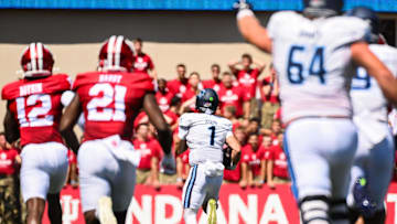 Aug 30, 2025; Bloomington, Indiana, USA; Old Dominion Monarchs quarterback Colton Joseph (1) runs for a touchdown against the Indiana Hoosiers during the first half at Memorial Stadium. Mandatory Credit: Robert Goddin-Imagn Images