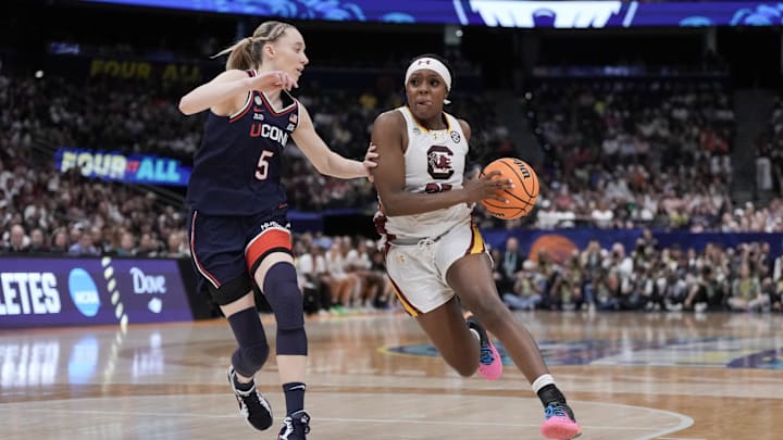Apr 6, 2025; Tampa, FL, USA; Connecticut Huskies guard Paige Bueckers (5) defends against South Carolina Gamecocks guard Raven Johnson (25) during the first half of the national championship of the women's 2025 NCAA tournament at Amalie Arena. Mandatory Credit: Kirby Lee-Imagn Images