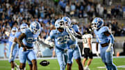 Nov 16, 2024; Chapel Hill, North Carolina, USA; North Carolina Tar Heels defensive back Marcus Allen (29) celebrates after making an interception in the third quarter at Kenan Memorial Stadium. Mandatory Credit: Bob Donnan-Imagn Images