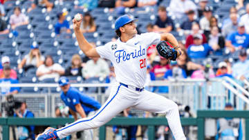 Jun 19, 2024; Omaha, NE, USA; Florida Gators pitcher Jake Clemente (20) pitches against the Kentucky Wildcats during the sixth inning at Charles Schwab Field Omaha. Mandatory Credit: Dylan Widger-Imagn Images