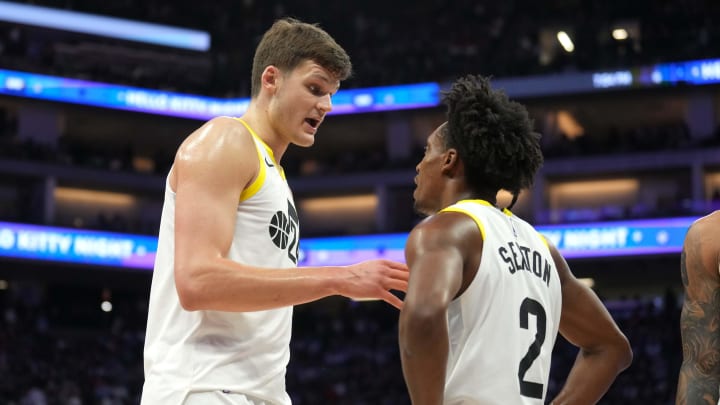 Mar 31, 2024; Sacramento, California, USA; Utah Jazz center Walker Kessler (left) talks with guard Collin Sexton (2) during halftime against the Sacramento Kings at Golden 1 Center. Mandatory Credit: Darren Yamashita-USA TODAY Sports