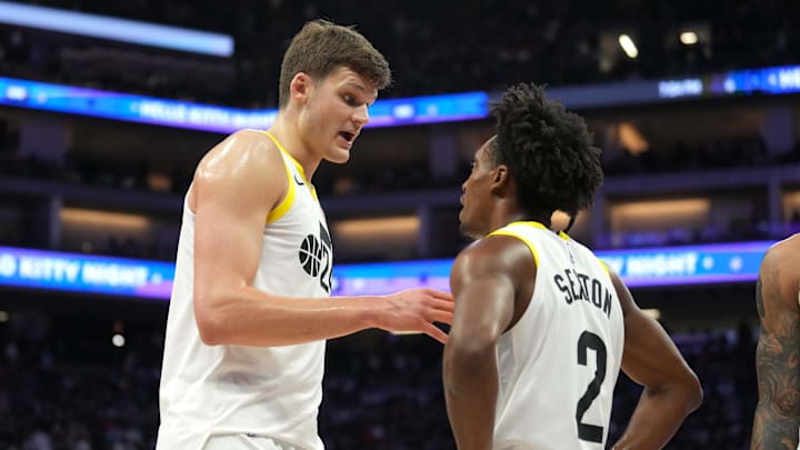 Mar 31, 2024; Sacramento, California, USA; Utah Jazz center Walker Kessler (left) talks with guard Collin Sexton (2) during halftime against the Sacramento Kings at Golden 1 Center. Mandatory Credit: Darren Yamashita-Imagn Images