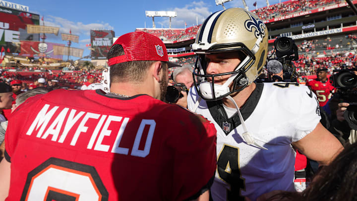 Dec 31, 2023; Tampa, Florida, USA;  New Orleans Saints quarterback Derek Carr (4) greets Tampa Bay Buccaneers quarterback Baker Mayfield (6) after a game at Raymond James Stadium. Mandatory Credit: Nathan Ray Seebeck-Imagn Images