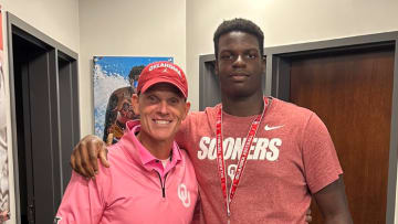 Brent Venables and 2025 OL Andrew Babalola