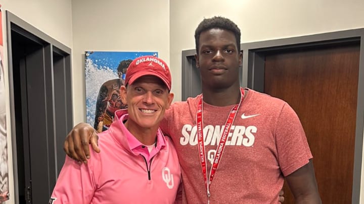 Brent Venables and 2025 OL Andrew Babalola